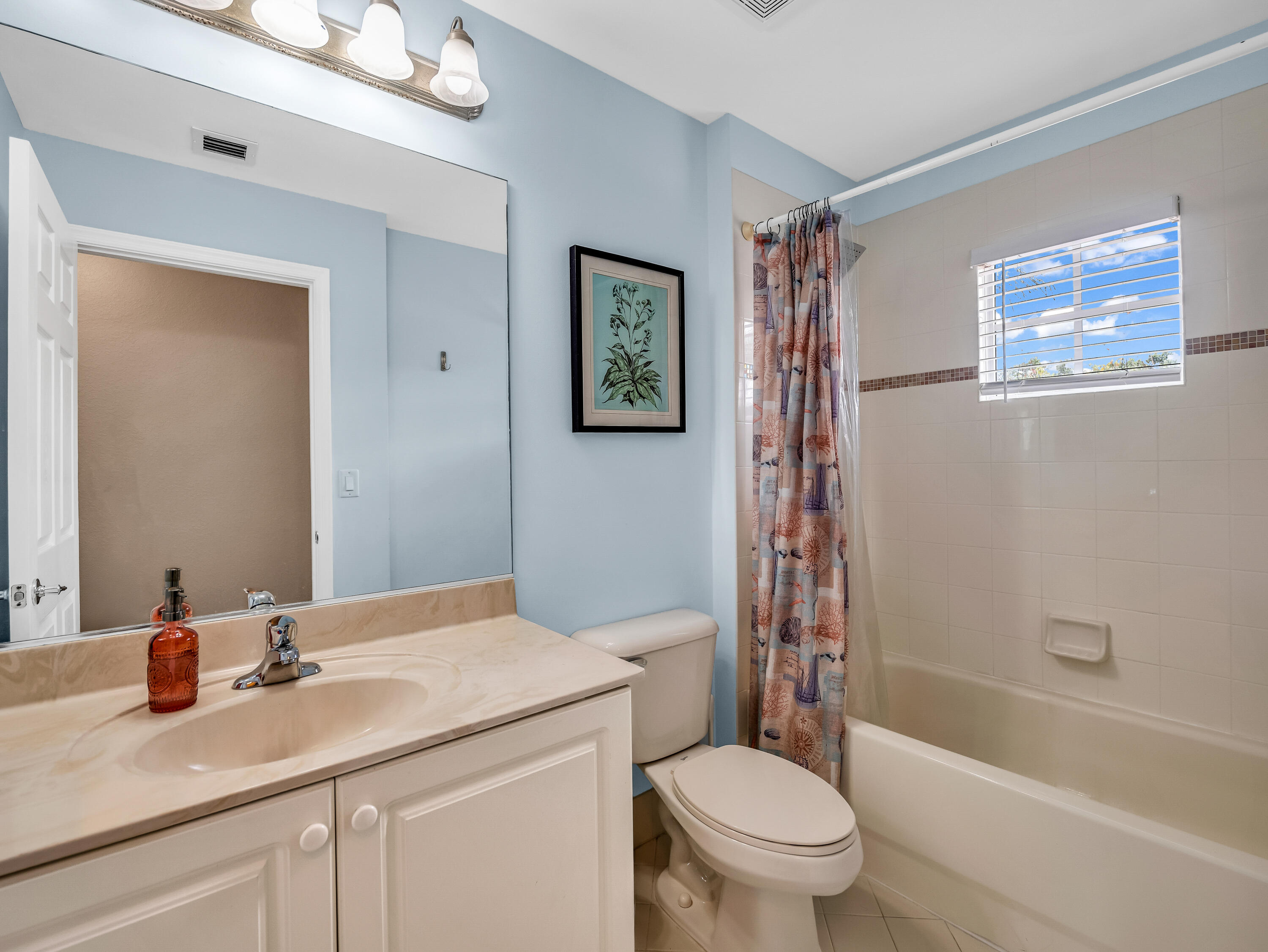7951 Red Mahogany Road Boynton Beach, FL 33437 - Photo 22 of 33 a bathroom with a granite countertop sink a toilet a shower and a mirror