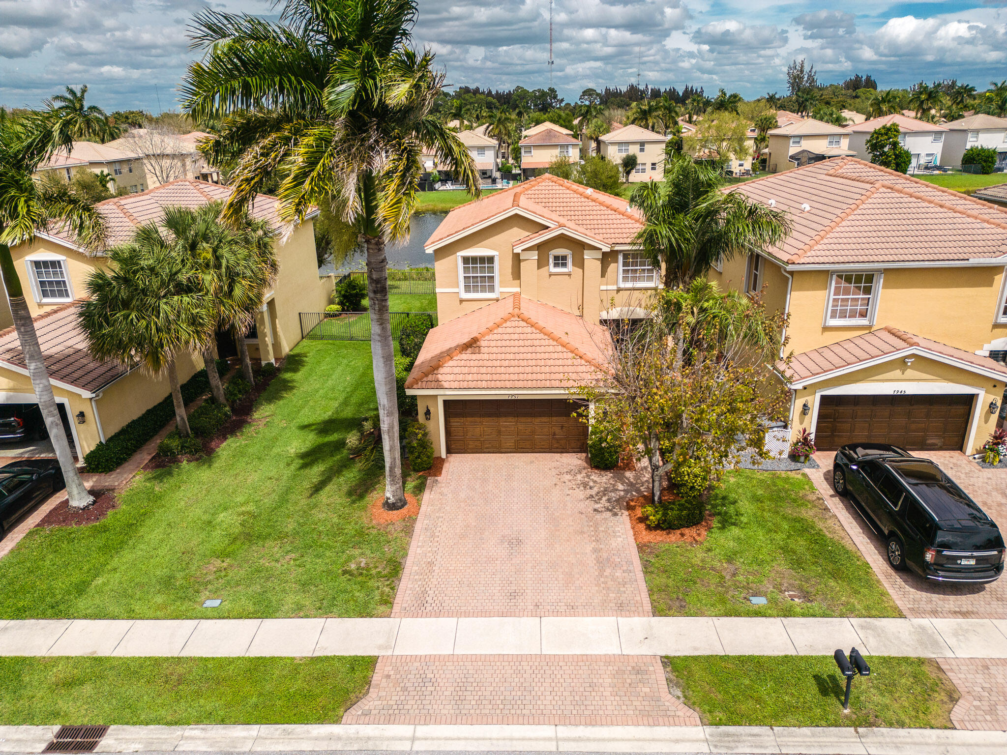 7951 Red Mahogany Road Boynton Beach, FL 33437 - Photo 32 of 33 a aerial view of a house with a yard