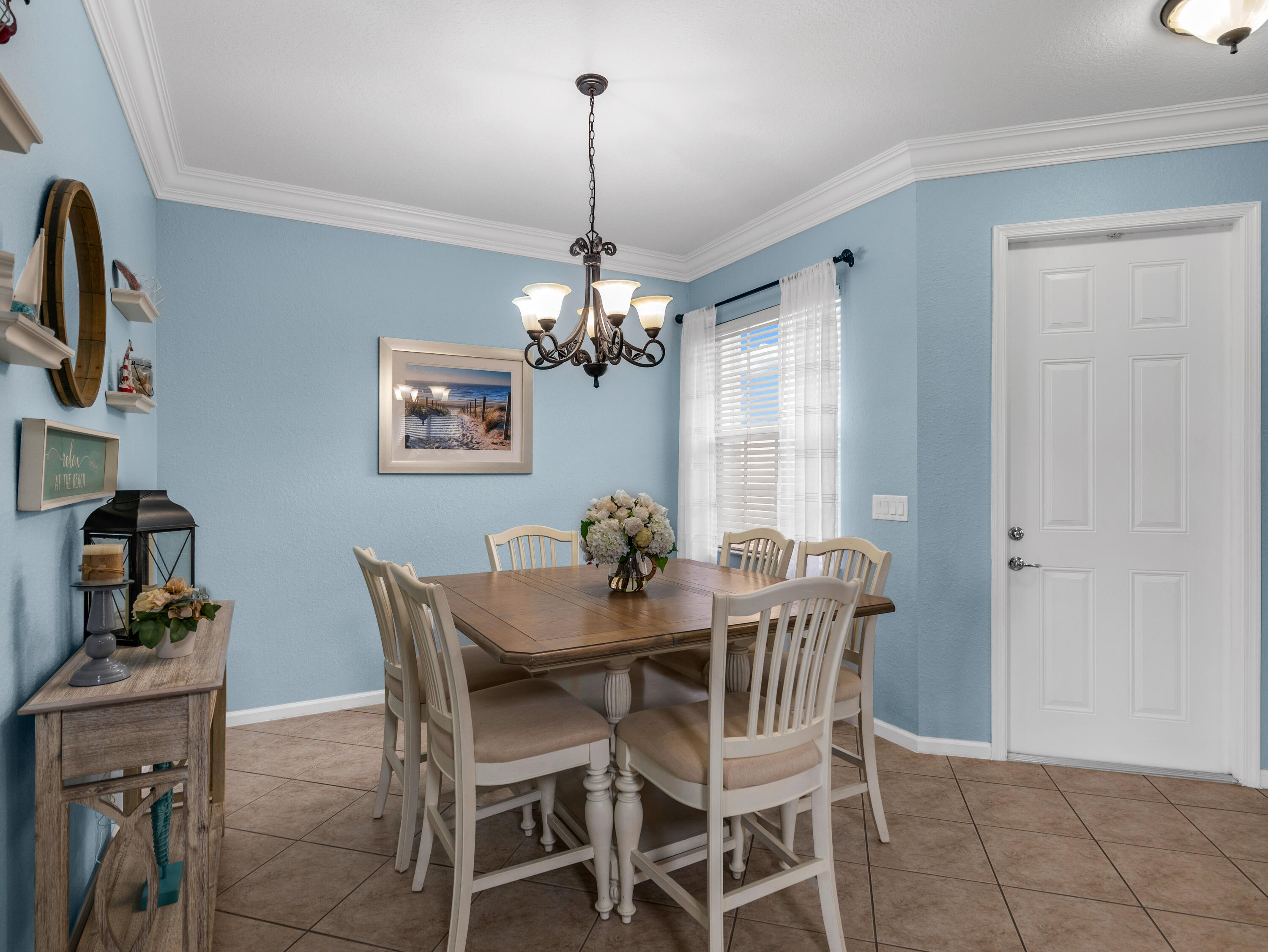 7951 Red Mahogany Road Boynton Beach, FL 33437 - Photo 9 of 33 a dining room with furniture and window