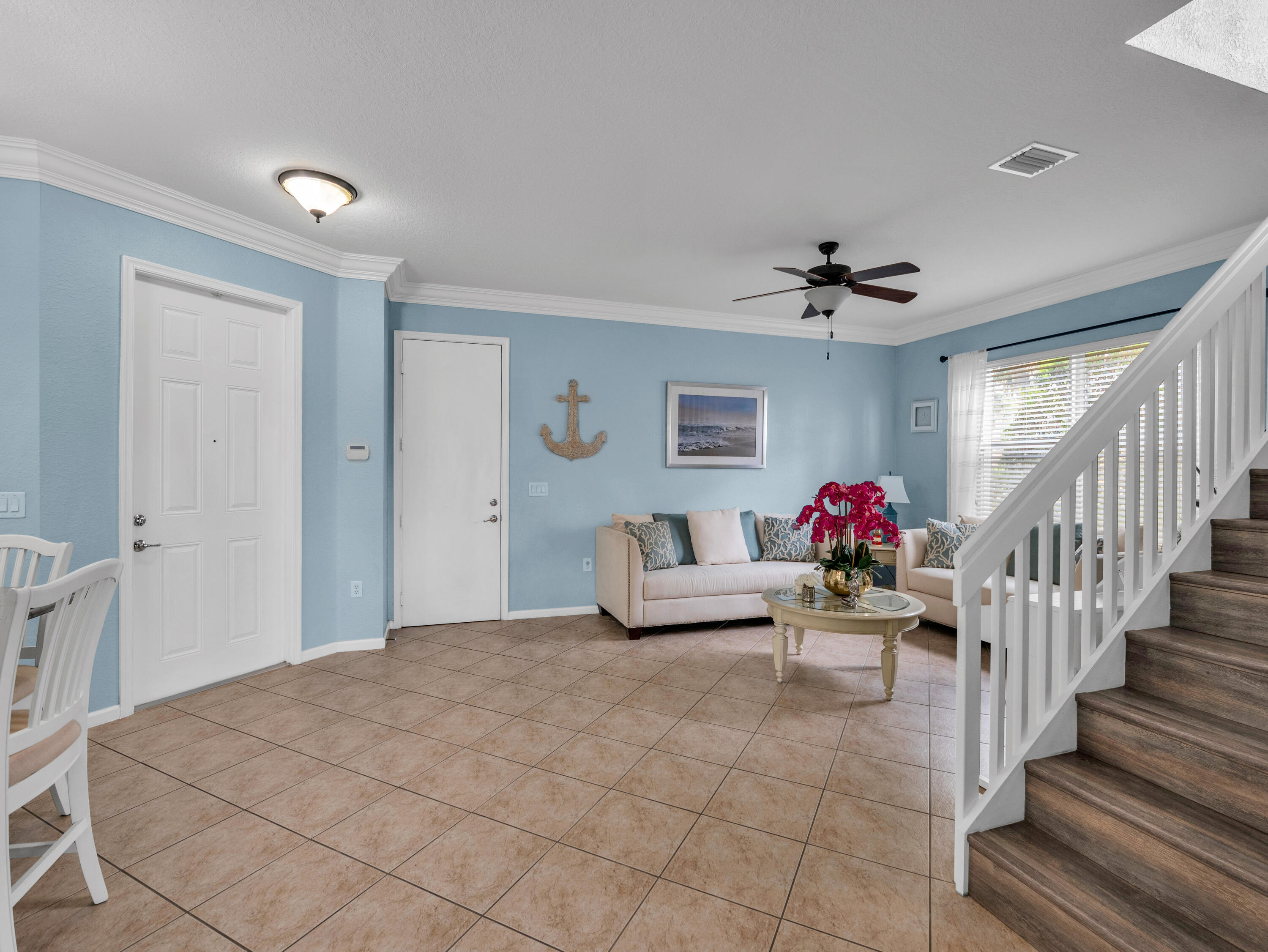 7951 Red Mahogany Road Boynton Beach, FL 33437 - Photo 10 of 33 a bedroom with furniture and a chandelier fan