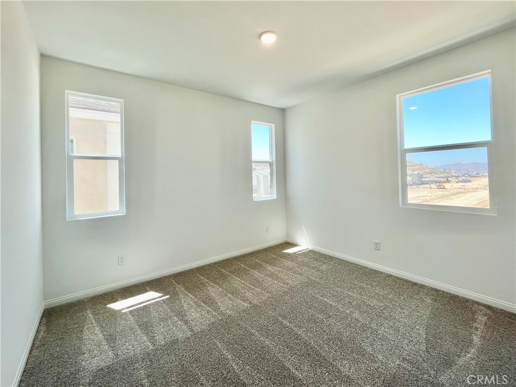 27391 Powder Ridge Court Valencia, CA 91381 - Photo 18 of 22 an empty room with windows