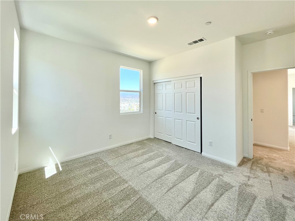 27391 Powder Ridge Court Valencia, CA 91381 - Photo 19 of 22 an empty room with a natural light