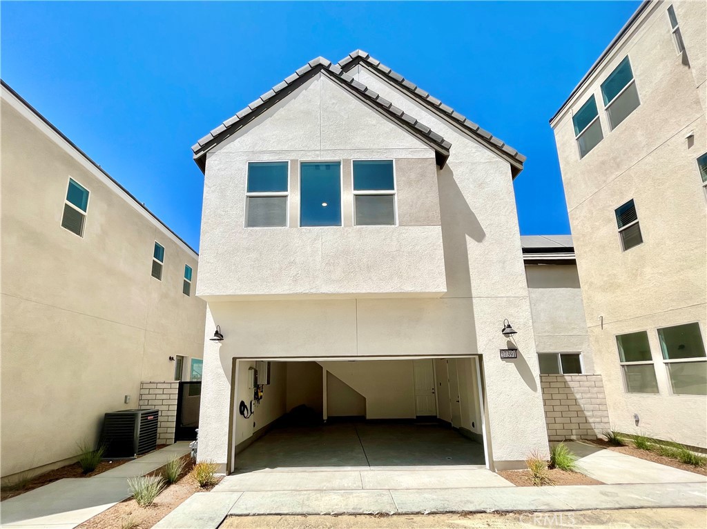 27391 Powder Ridge Court Valencia, CA 91381 - Photo 21 of 22 a front view of a house with garage