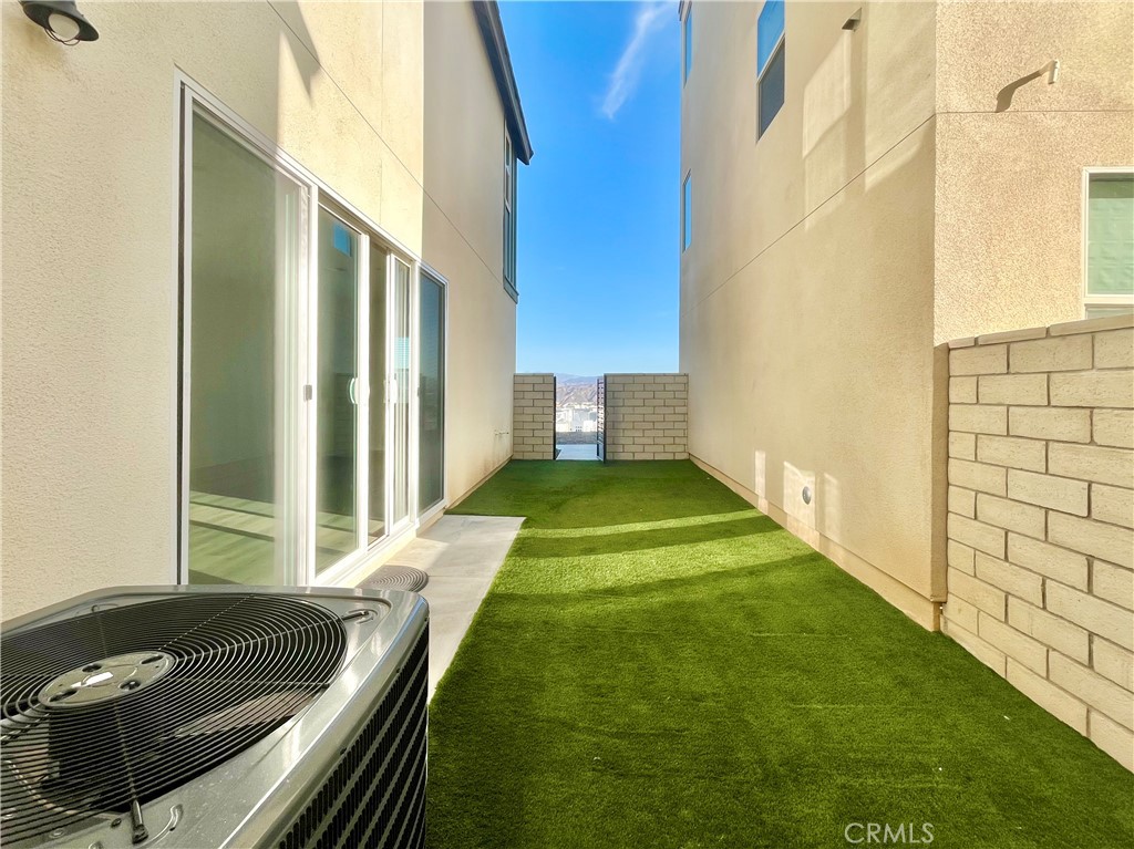 27391 Powder Ridge Court Valencia, CA 91381 - Photo 22 of 22 a living room with a bed and a couch