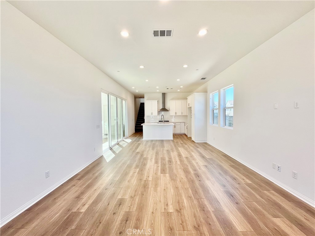 27391 Powder Ridge Court Valencia, CA 91381 - Photo 3 of 22 a view of empty room with wooden floor