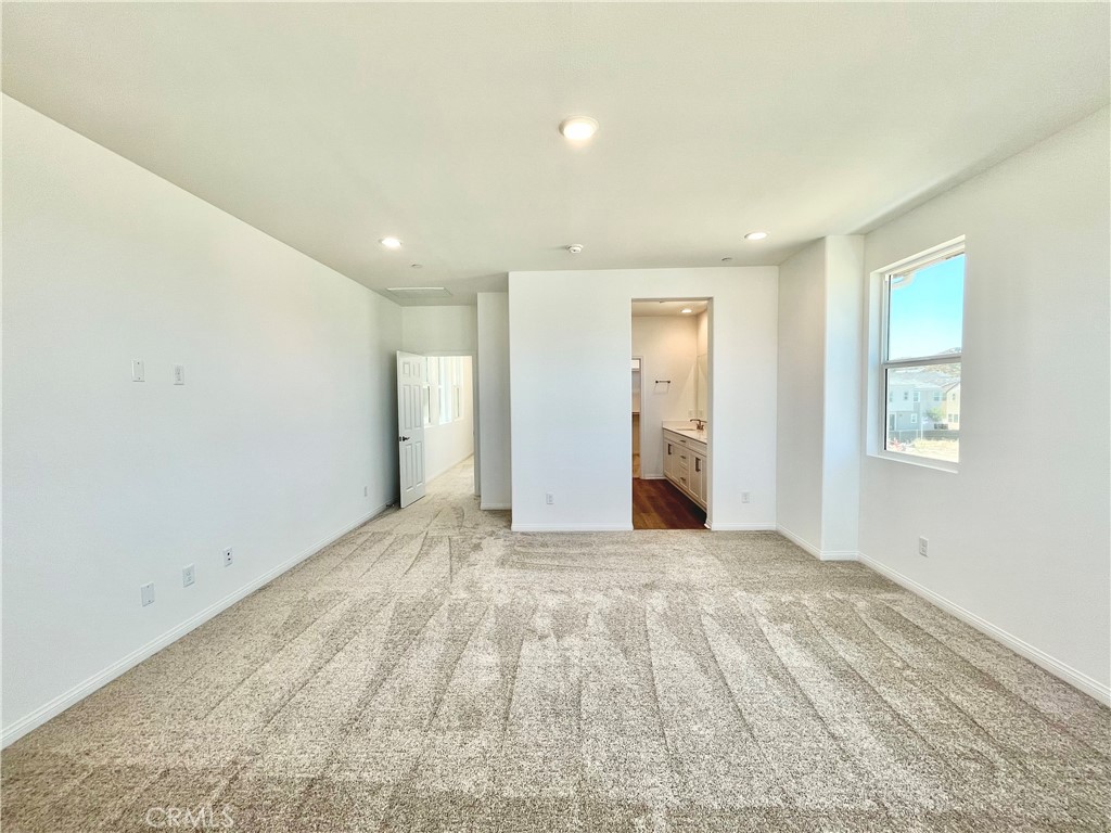 27391 Powder Ridge Court Valencia, CA 91381 - Photo 10 of 22 a view of empty room with windows