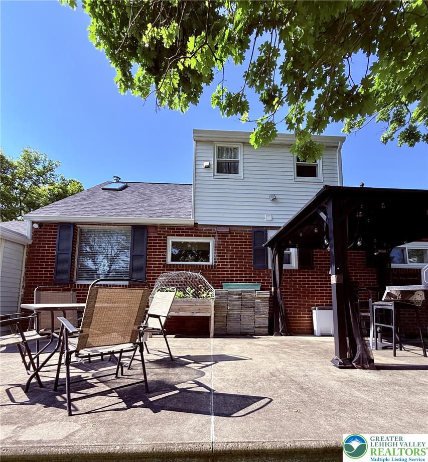 1275 Macada Road Bethlehem, PA 18017 - Photo 13 of 87 a front view of a house with table and chairs