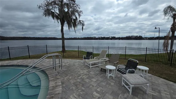 a terrace with outdoor seating and city view