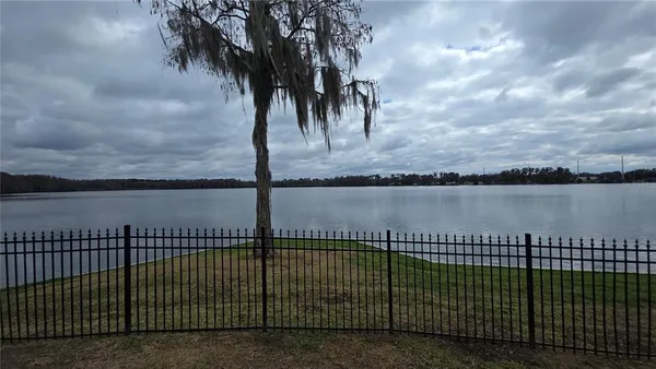 a view of a swimming pool with a yard
