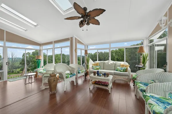 a living room with furniture and a large window