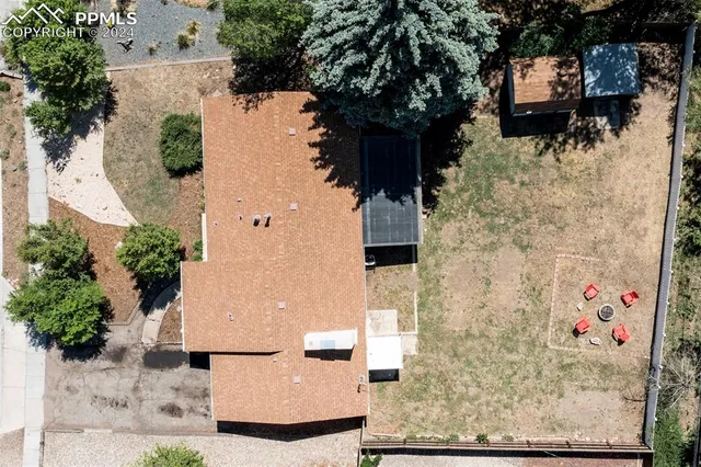 an aerial view of residential houses with outdoor space