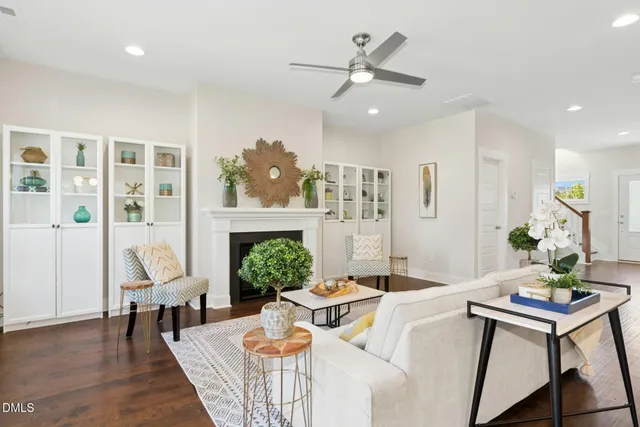a living room with kitchen island furniture and a dining table with kitchen view