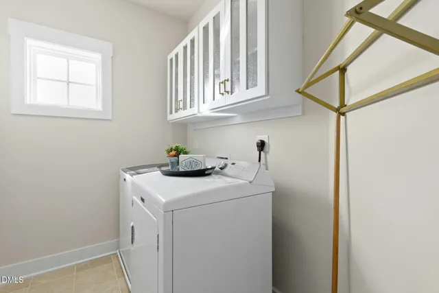 a bathroom with a double vanity sink toilet and shower