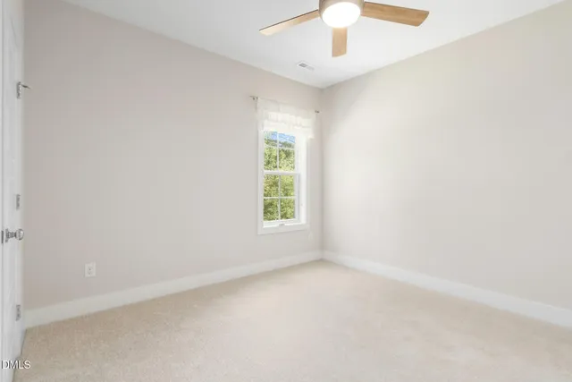 a view of a wooden balcony and floor to ceiling window and wooden floor