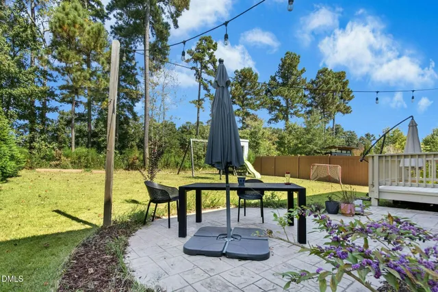 a view of swimming pool with a tree