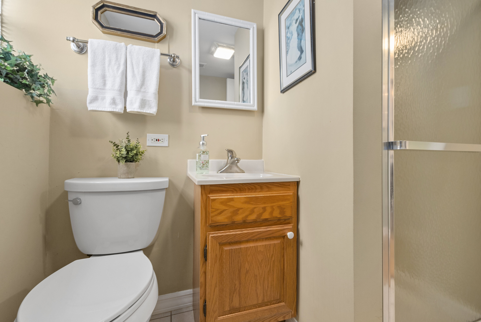 9 Merry Court Countryside, IL 60525 - Photo 14 of 19 a white toilet sitting next to a bathroom sink