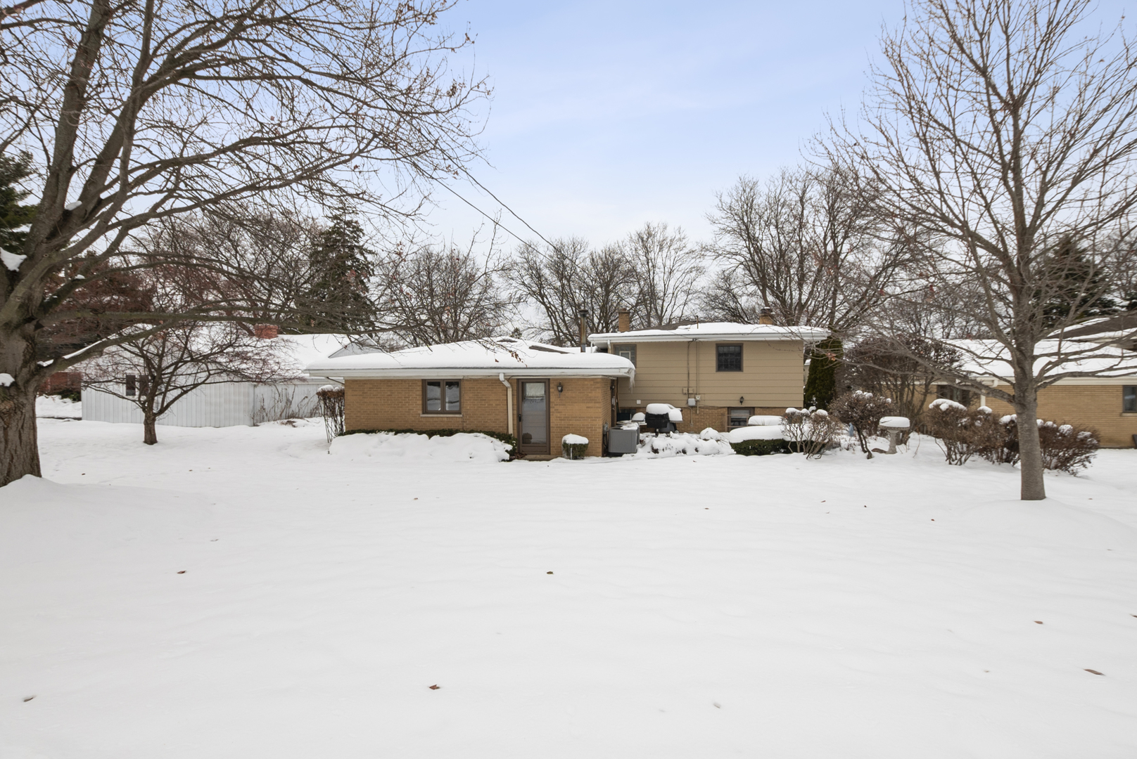 9 Merry Court Countryside, IL 60525 - Photo 15 of 19 a view of a house with a yard covered in snow