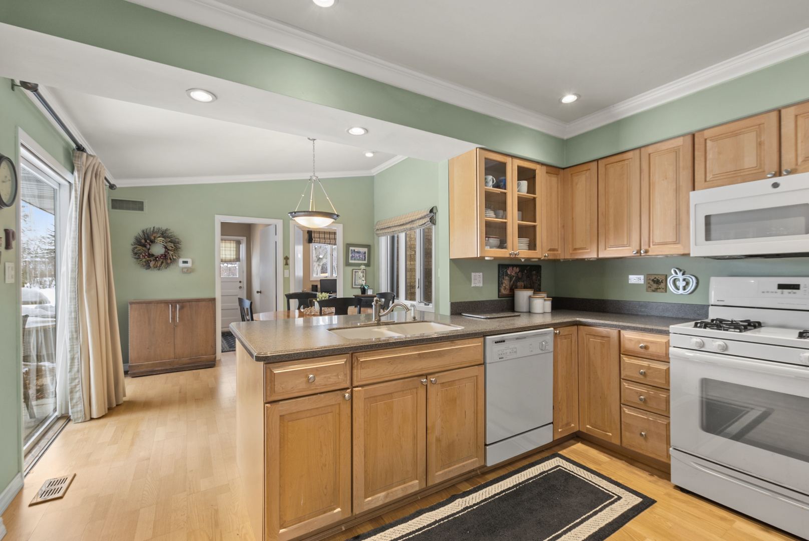 9 Merry Court Countryside, IL 60525 - Photo 6 of 19 a kitchen with sink cabinets and window