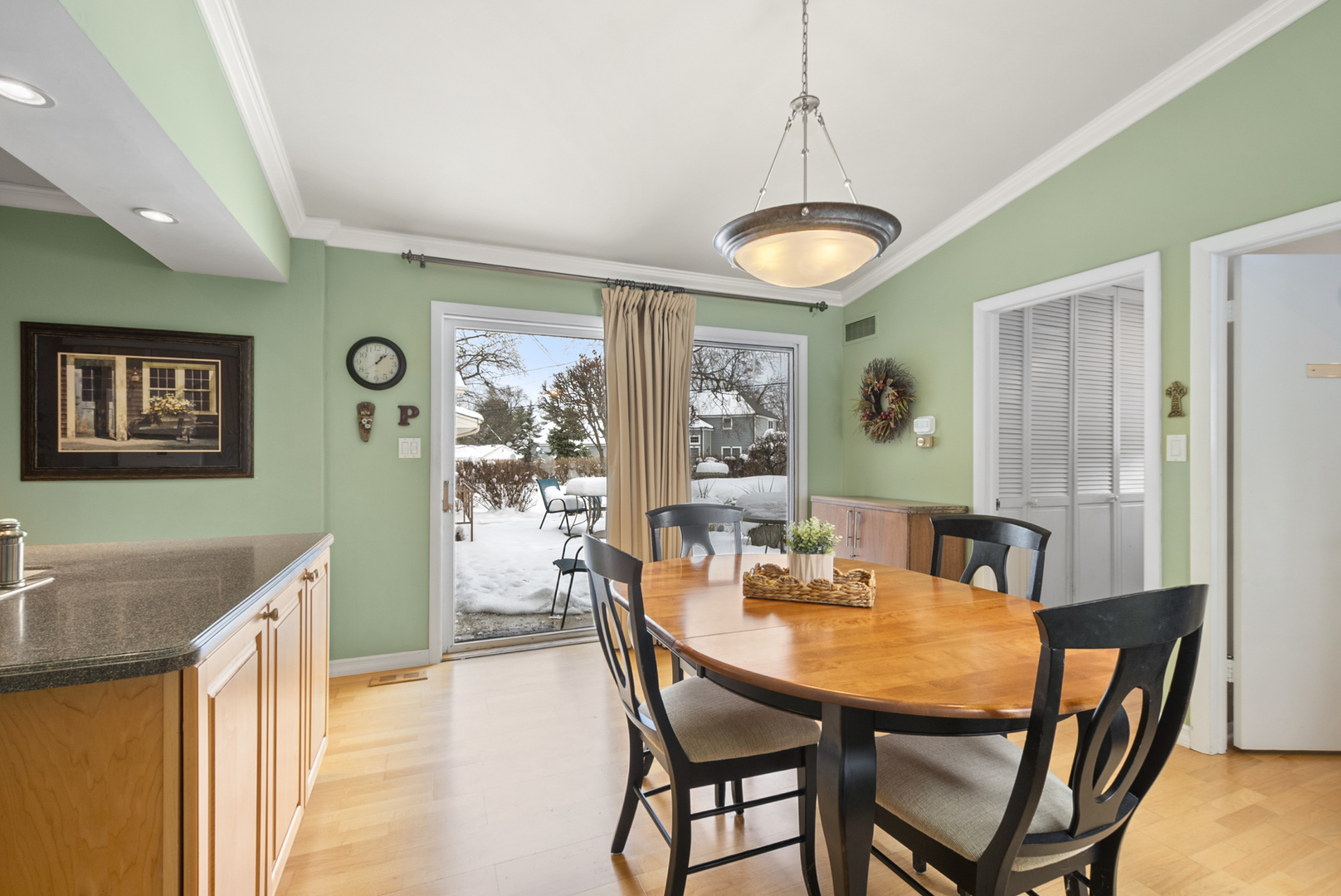 9 Merry Court Countryside, IL 60525 - Photo 7 of 19 a view of a dining room with furniture and chandelier