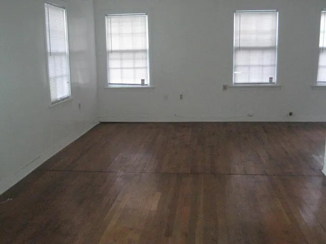 an empty room with windows