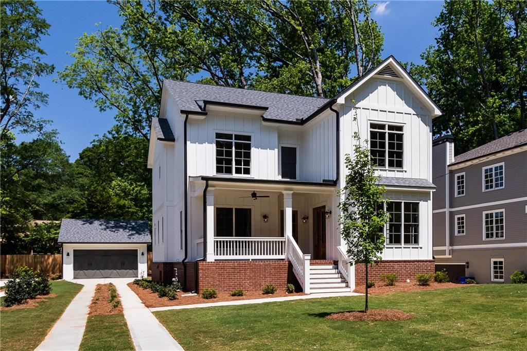 937 Derrydown Way Decatur, GA 30030 - Photo 1 of 1 a front view of a house with a yard and garage
