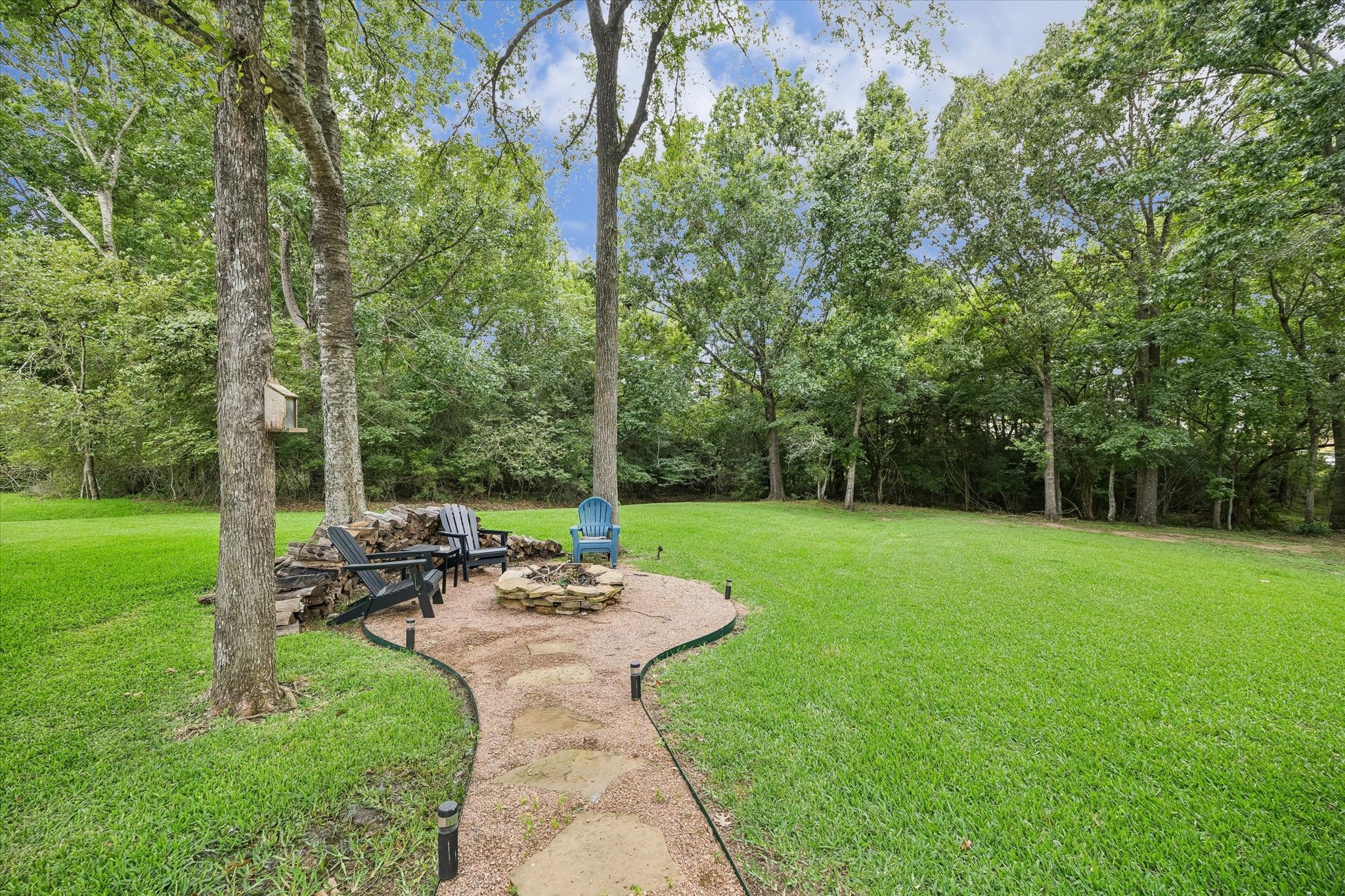 19973 Peel Road Montgomery, TX 77356 - Photo 27 of 31 Firepit area on the front left of your expansive property.