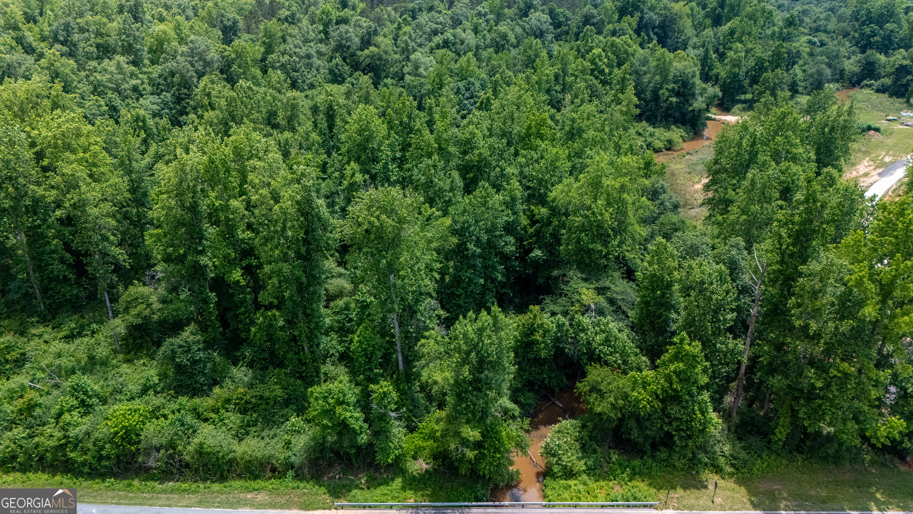 0 Adams Road West Point, GA 31833 - Photo 3 of 9 an aerial view of residential house with outdoor space and trees all around