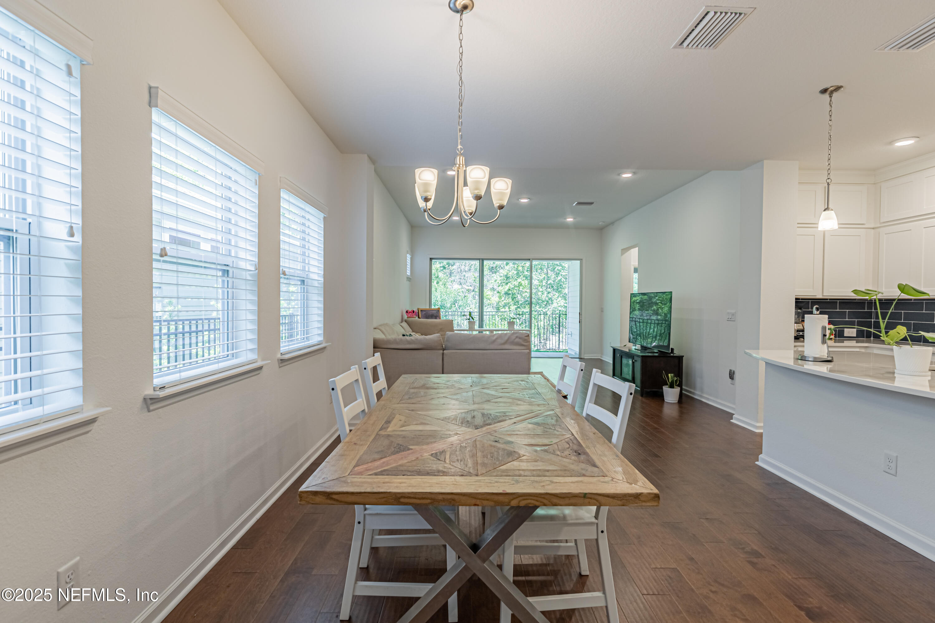 383 Windswept Way Street St. Augustine, FL 32092 - Photo 8 of 34 a view of a dining room with furniture window and wooden floor