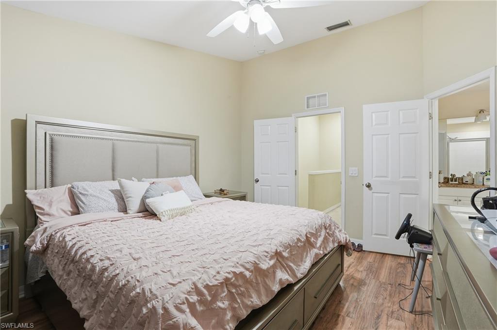 1013 Hampton Circle, Unit 127 Naples, FL 34105 - Photo 12 of 21 a bedroom with a bed and a view of living room