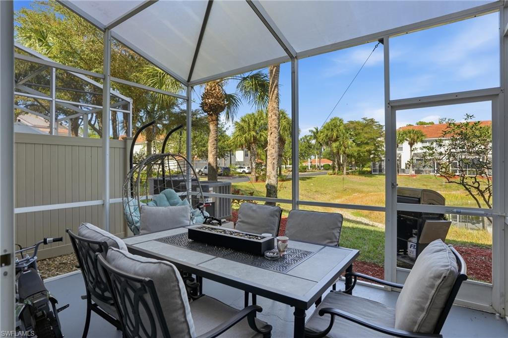 1013 Hampton Circle, Unit 127 Naples, FL 34105 - Photo 20 of 21 a view of a dining room with furniture window and outside view
