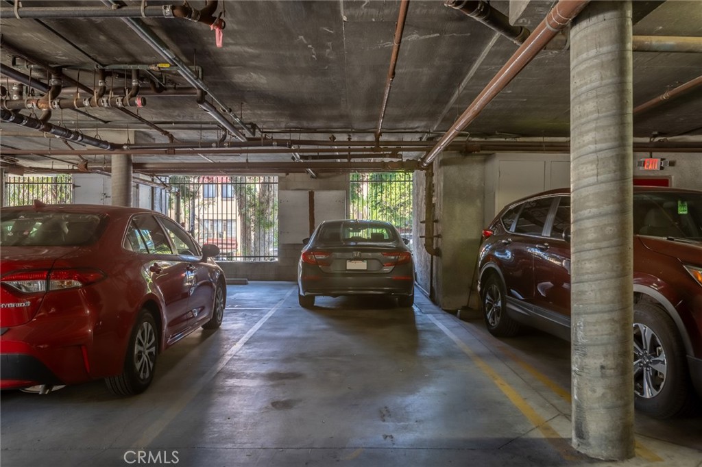 726 Elm Avenue, Unit 404 Long Beach, CA 90813 - Photo 30 of 31 a view of parking garage with cars