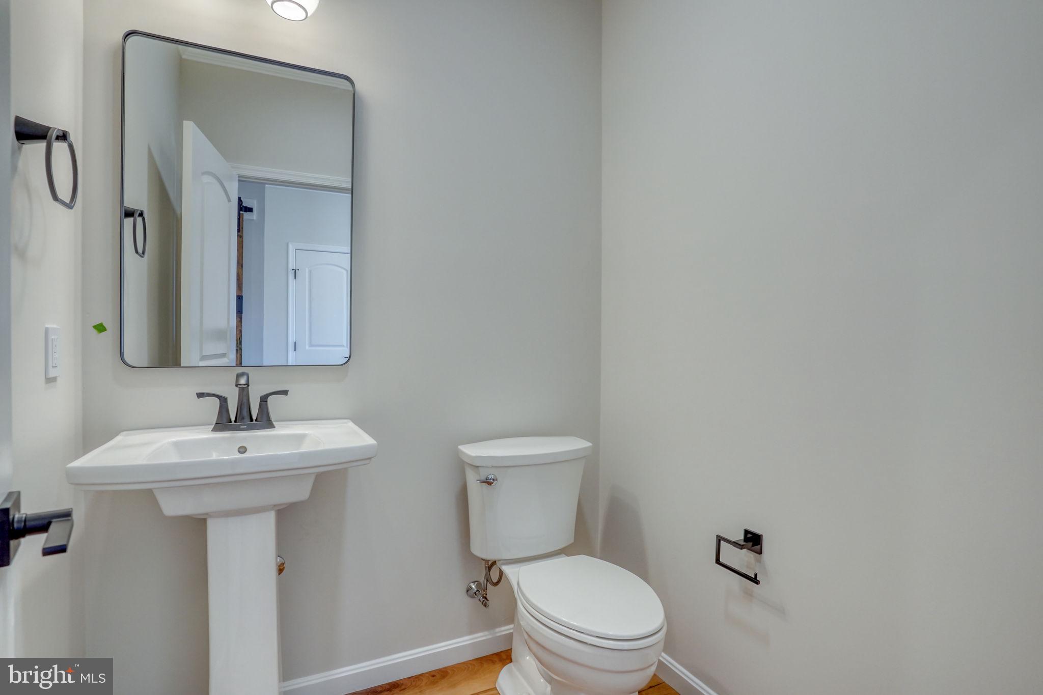 39 Doc Court Felton, DE 19943 - Photo 16 of 70 a bathroom with a sink mirror and toilet