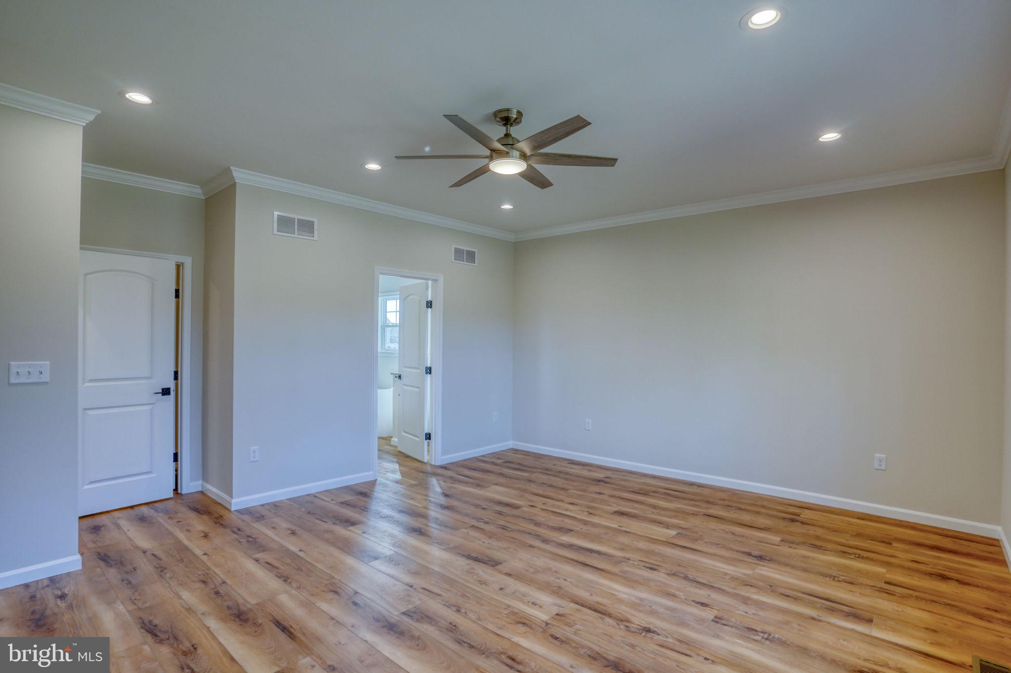 39 Doc Court Felton, DE 19943 - Photo 20 of 36 a view of a room with wooden floor and a ceiling fan