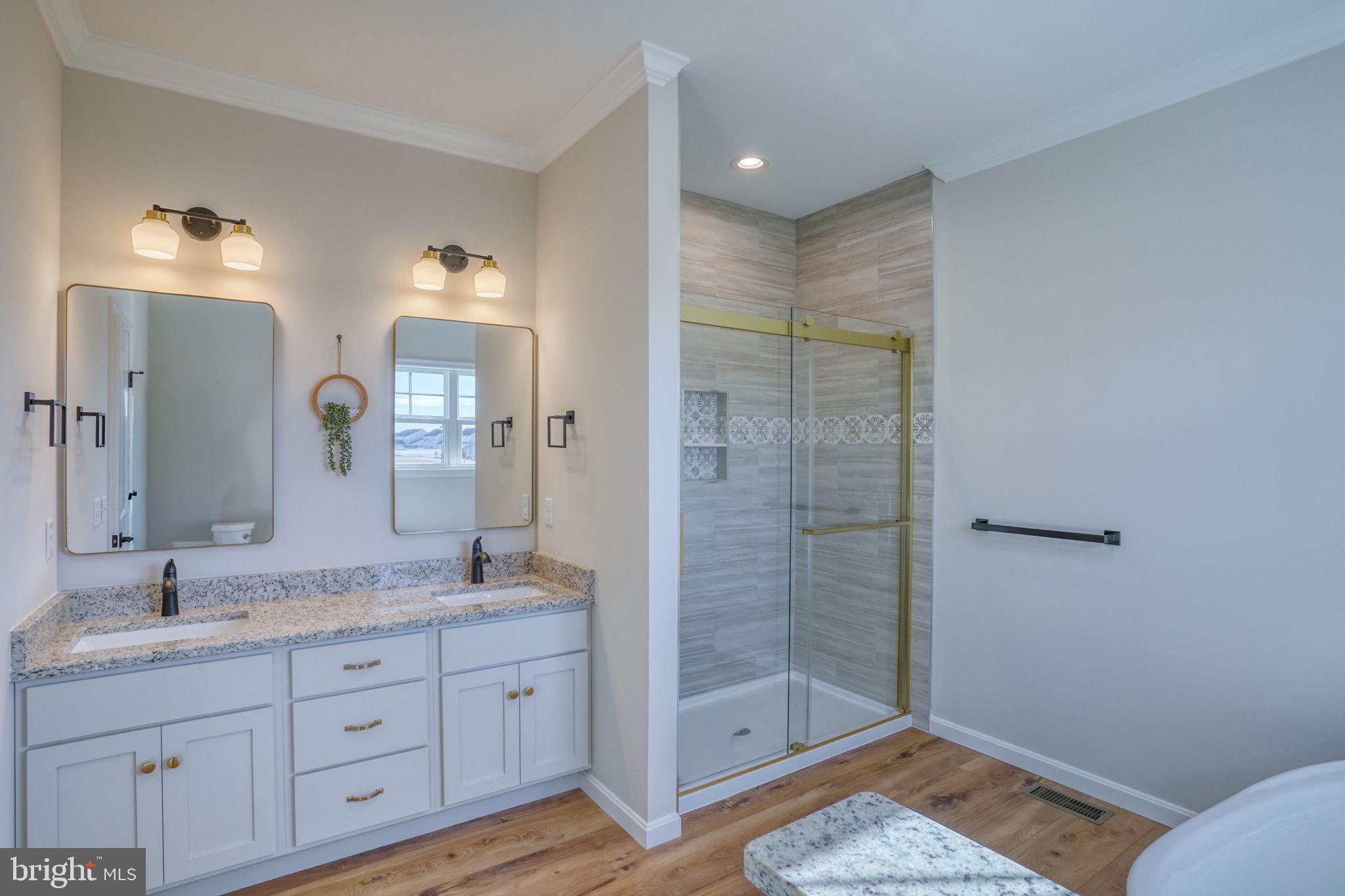 39 Doc Court Felton, DE 19943 - Photo 21 of 36 a bathroom with a granite countertop sink mirror and shower