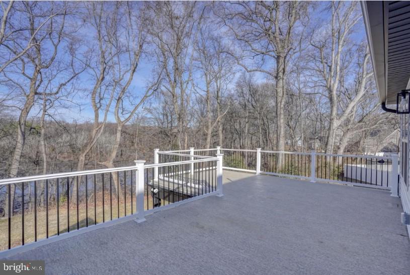 39 Doc Court Felton, DE 19943 - Photo 3 of 36 a view of a roof deck with wooden fence and floor