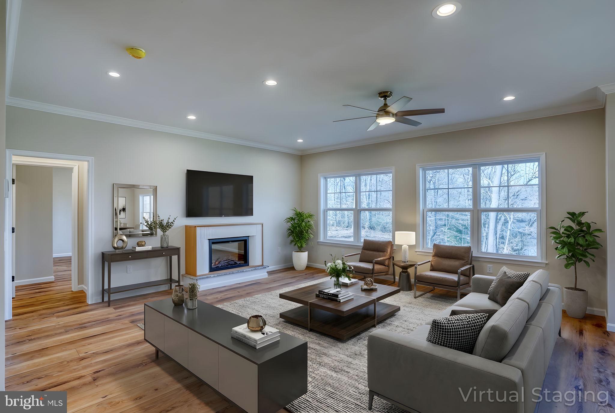 39 Doc Court Felton, DE 19943 - Photo 31 of 70 a living room with fireplace furniture and a flat screen tv