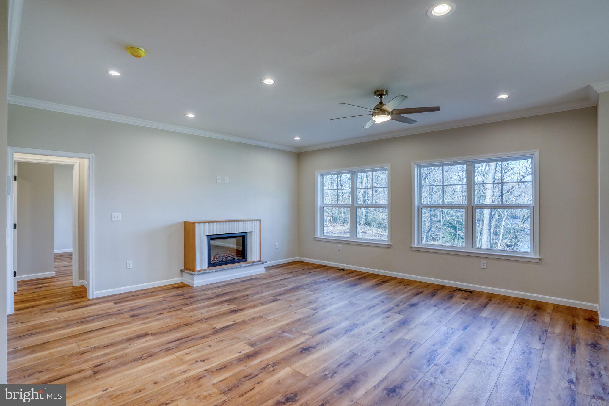 39 Doc Court Felton, DE 19943 - Photo 32 of 70 a view of an empty room with wooden floor and a window