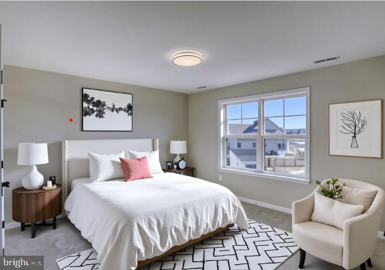 39 Doc Court Felton, DE 19943 - Photo 57 of 70 a spacious bedroom with a bed a couch and a window