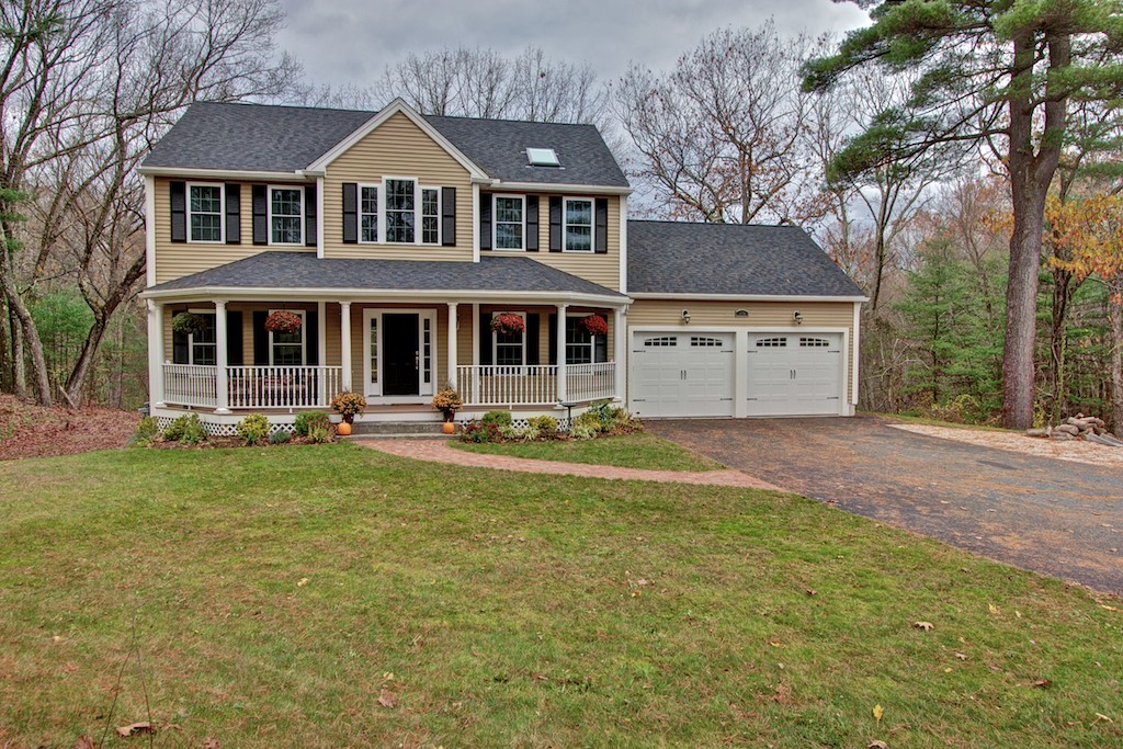 550 Edgell Road Framingham, MA 01701 - Photo 1 of 29 a front view of a house with garden