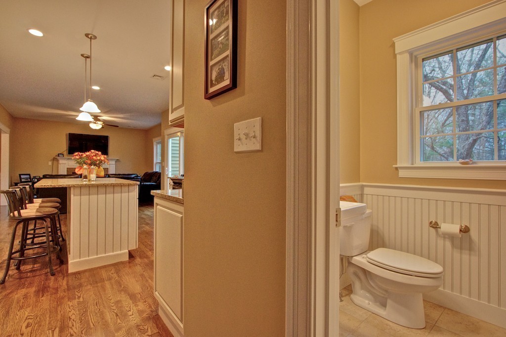 550 Edgell Road Framingham, MA 01701 - Photo 19 of 29 a bathroom with a sink a toilet a mirror and a shower
