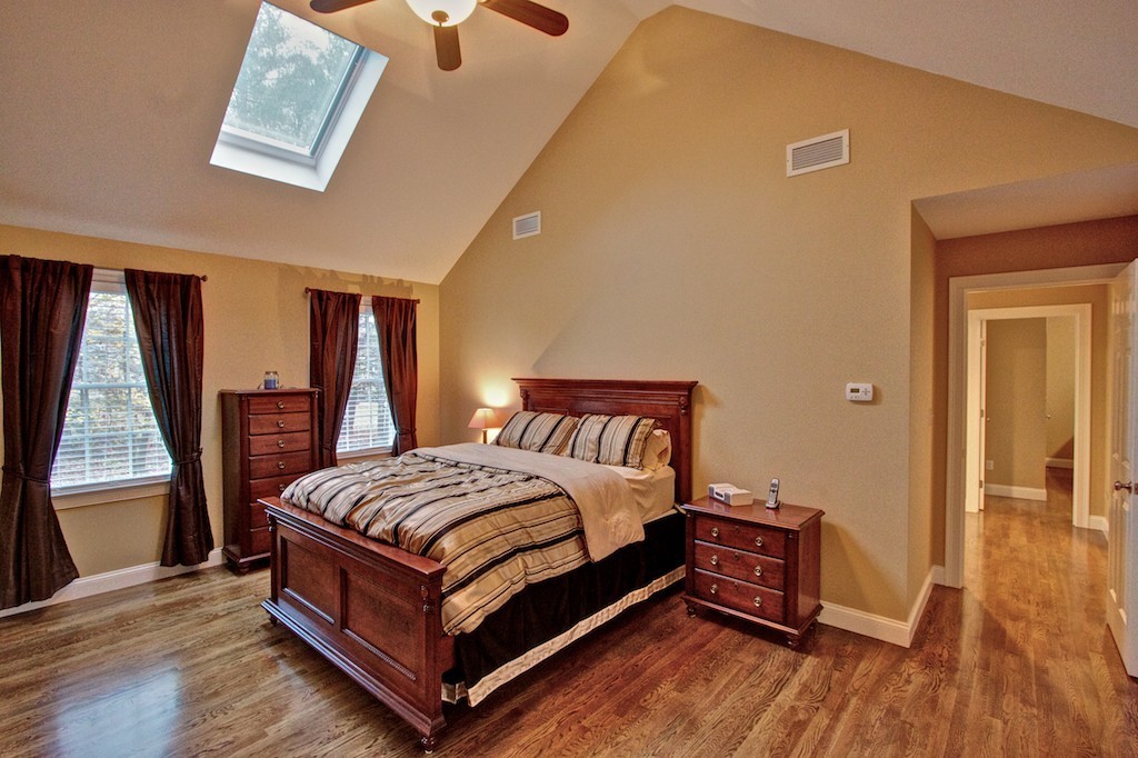 550 Edgell Road Framingham, MA 01701 - Photo 20 of 29 a bedroom with a bed and wooden floor