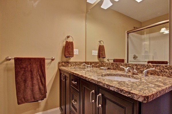 550 Edgell Road Framingham, MA 01701 - Photo 24 of 29 a bathroom with a granite countertop sink and a mirror