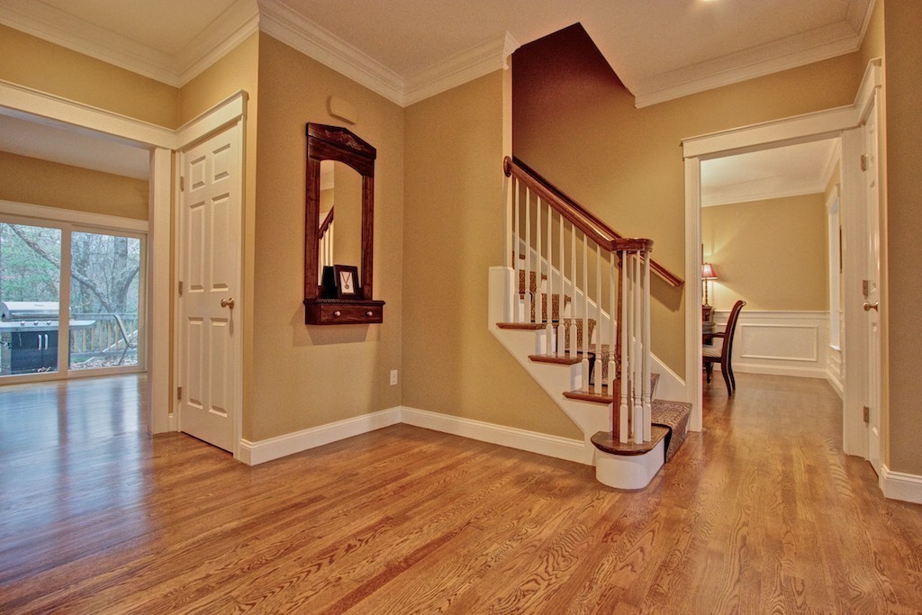 550 Edgell Road Framingham, MA 01701 - Photo 4 of 29 a view of an entryway with wooden floor and door