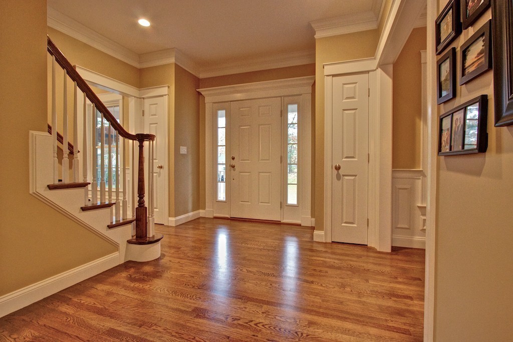 550 Edgell Road Framingham, MA 01701 - Photo 5 of 29 a view of an entryway with wooden floor and door