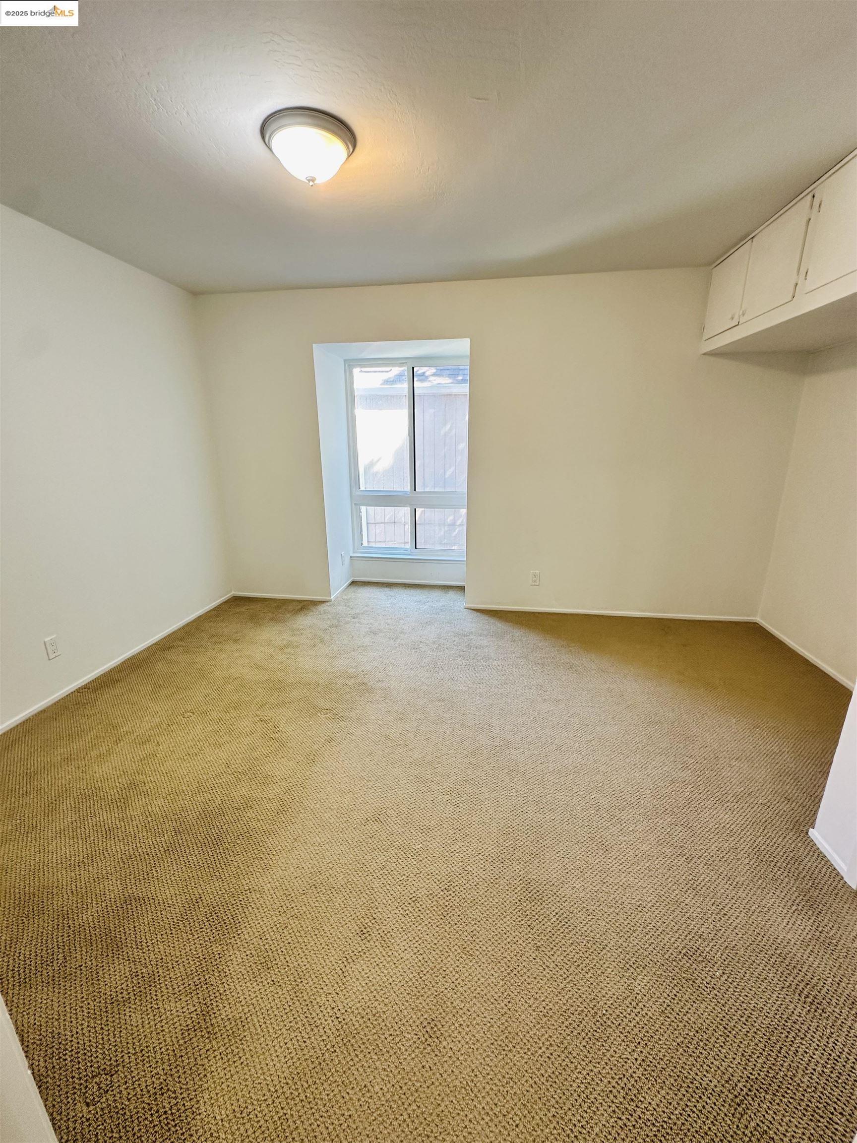 9005 Alcosta Boulevard, Unit 189 San Ramon, CA 94583 - Photo 15 of 20 an empty room with a empty space and windows