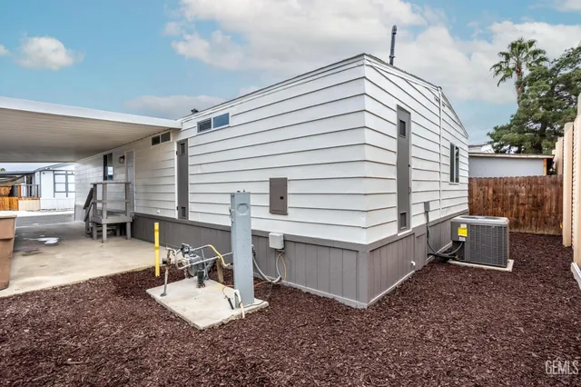 a view of a patio with a chairs and table in the patio