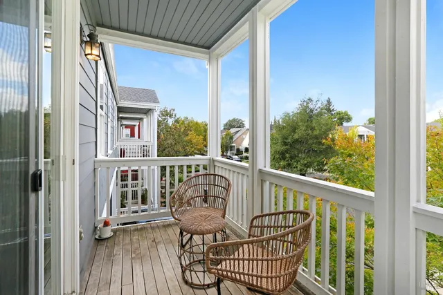 a view of a balcony with furniture