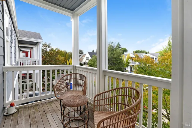 a view of a balcony with furniture
