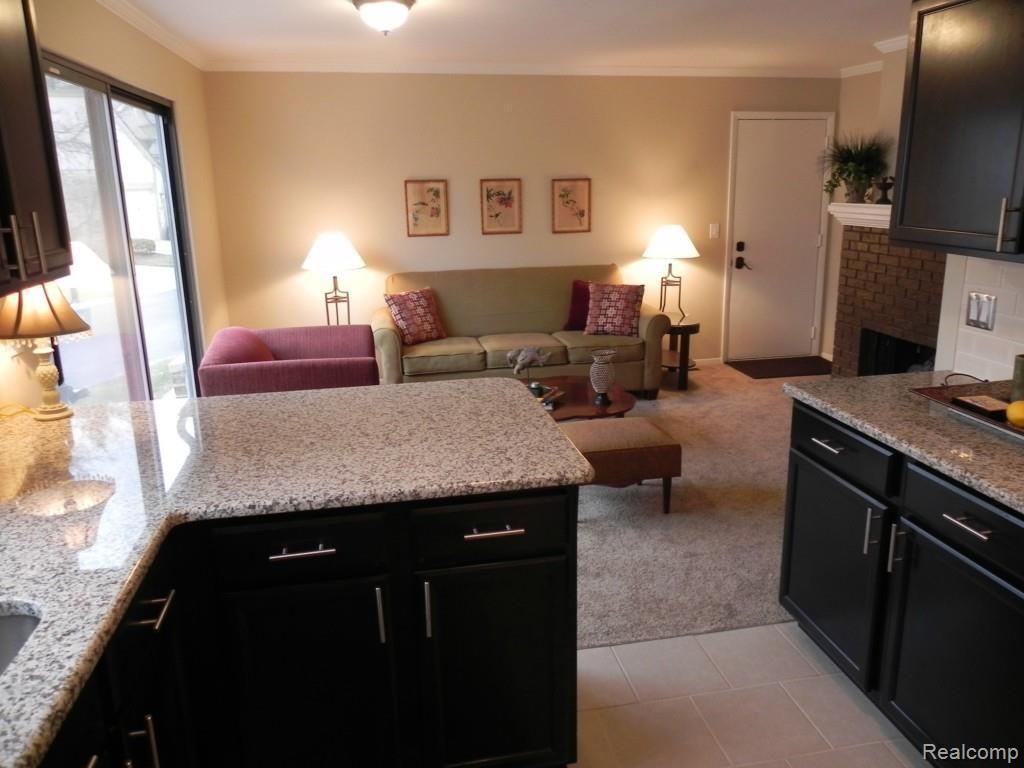 23175 Farmington Road Farmington, MI 48336 - Photo 12 of 31 View from kitchen breakfast bar into family room