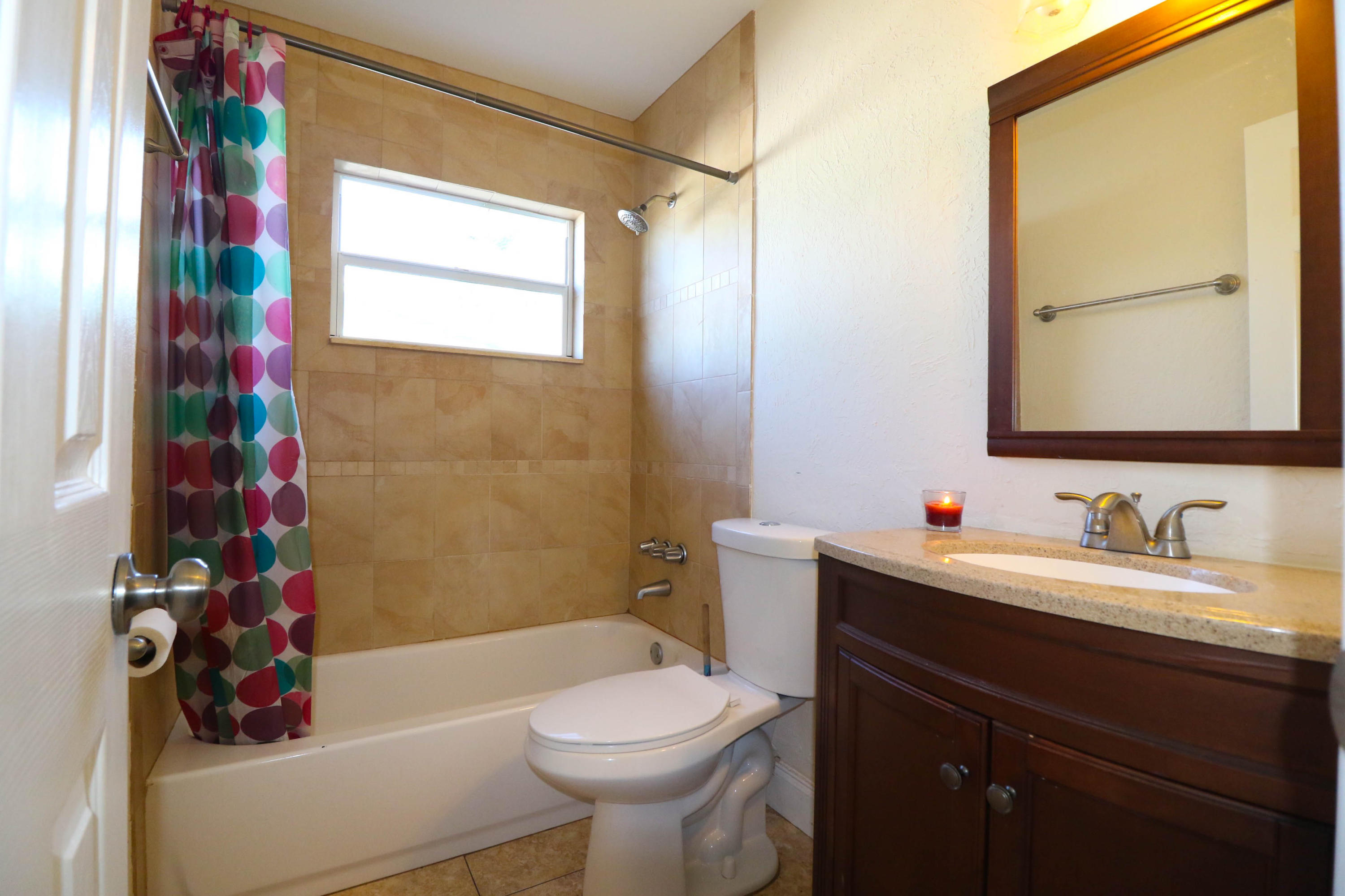 3302 Bermuda Road Palm Beach Gardens, FL 33410 - Photo 7 of 12 a bathroom with a sink toilet and shower